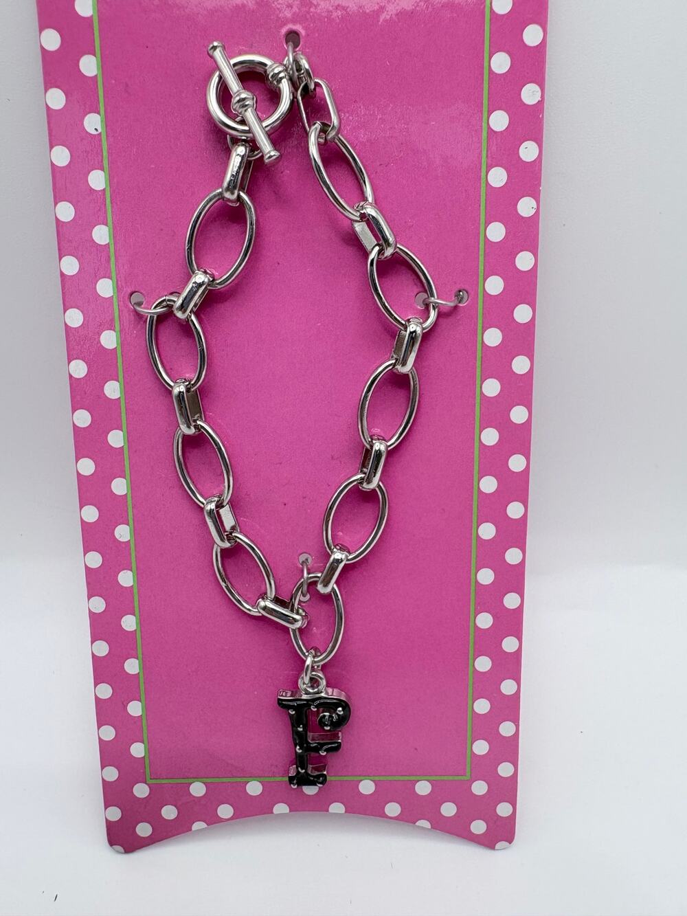 Initial “F” in Black with Silver Polka Dots on Silver-Tone Oval Link Bracelet